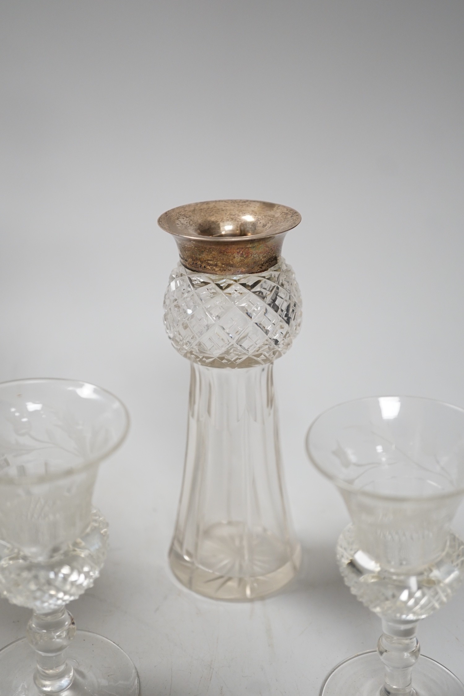 A late Victorian engraved thistle shaped liqueur decanter, 4 glasses and a pair of silver mounted jars